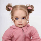 Muñeca reborn realista con ropa rosa