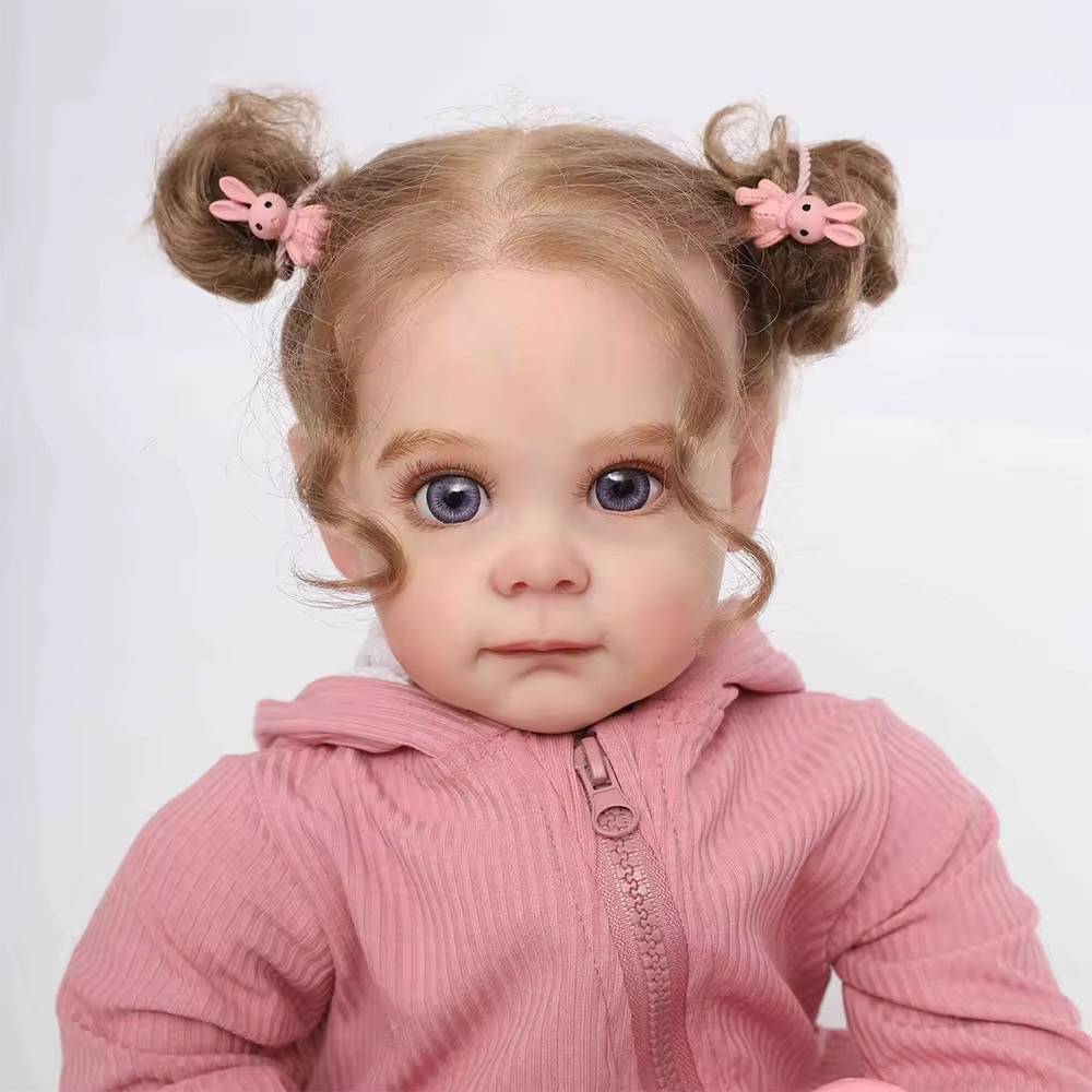 Muñeca reborn realista con ropa rosa